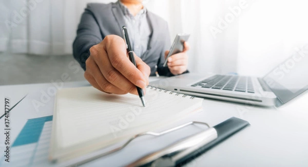 Fototapeta Digital marketing media in virtual screen.businesswoman hand working with mobile phone and modern compute with VR icon diagram at office in morning light