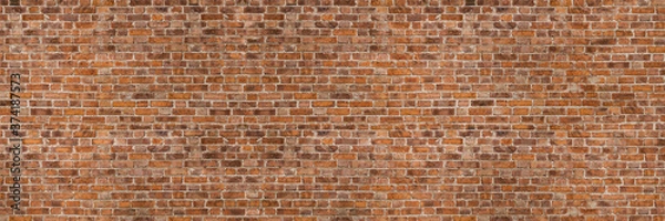 Fototapeta Vintage exposed brown and red old brick wall. Brickwork textured background and long brown banner.