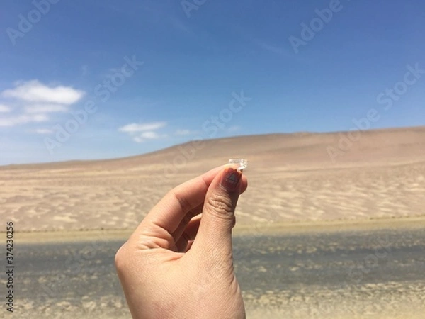 Obraz hand holding a spoon