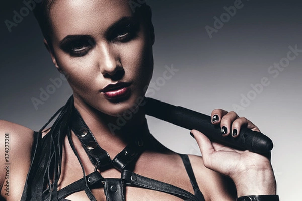 Obraz portrait of woman with whip around neck