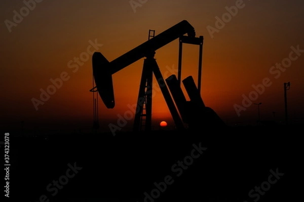 Obraz oil pump in sunset with sunset in Bahrain