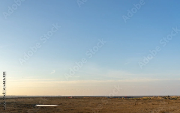 Obraz Wooden fence on a field / Sunset on the beach / sunset over the river