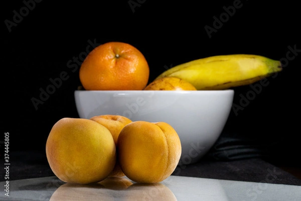 Obraz peaches on black background, dark food