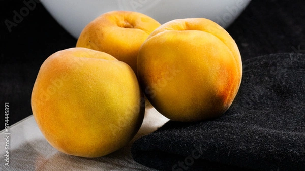 Obraz peaches on black background, dark food
