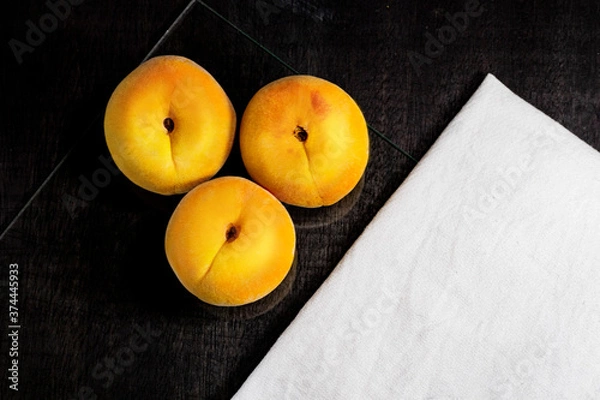 Obraz peaches on black background, dark food