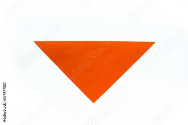 Fototapeta Step-by-step origami instructions. How to make a dog out of orange colored paper. Instructions on a white background top view. Step 4.
