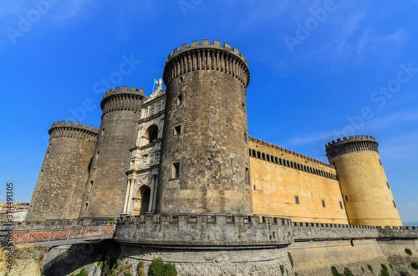 Fototapeta Castel Nuovo Medieval fortress with 5 towers and a Renaissance triumphal arch often called Maschio Angioino one of the main architectural landmarks of the city.