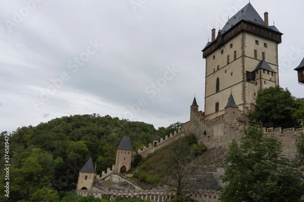 Fototapeta 
Stones Charles Bridge from 1402. On the Vltava river at night. pulmonary lighting and light reflections on the river surface and the moon shines in the sky.