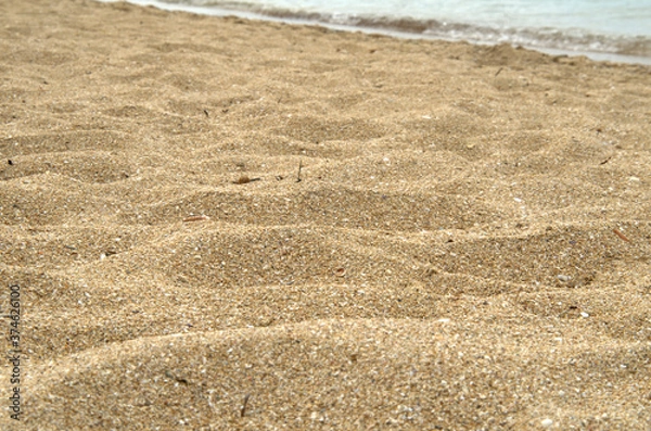 Fototapeta Primo piano alla calda e soffice spiaggia del mare.