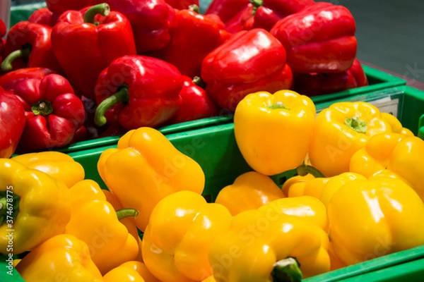 Fototapeta fresh ripe red and yellow sweet peppers from market
