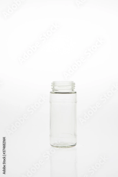 Fototapeta Isolated glass bottle on white background without cap.