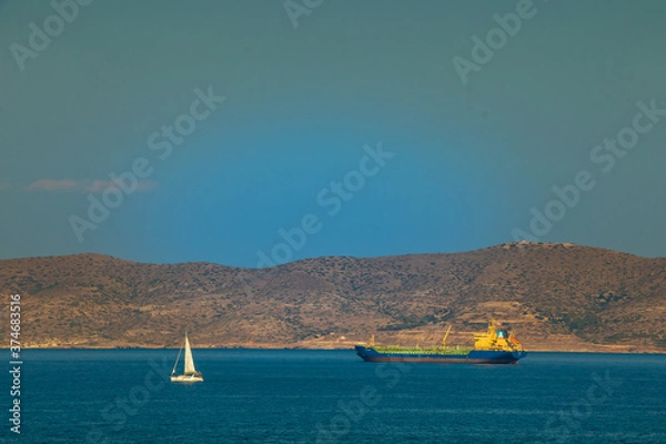 Obraz A yatch and a tanker in front of Kea Island