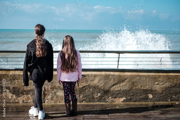 Obraz Two girls by the oceanfront