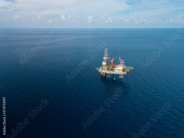 Obraz Aerial view from a drone of an offshore jack up rig at the offshore location during day time