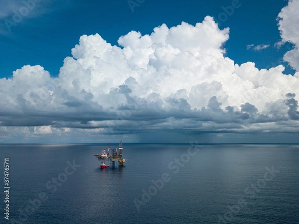 Fototapeta Aerial view from a drone of an offshore jack up rig at the offshore location during day time