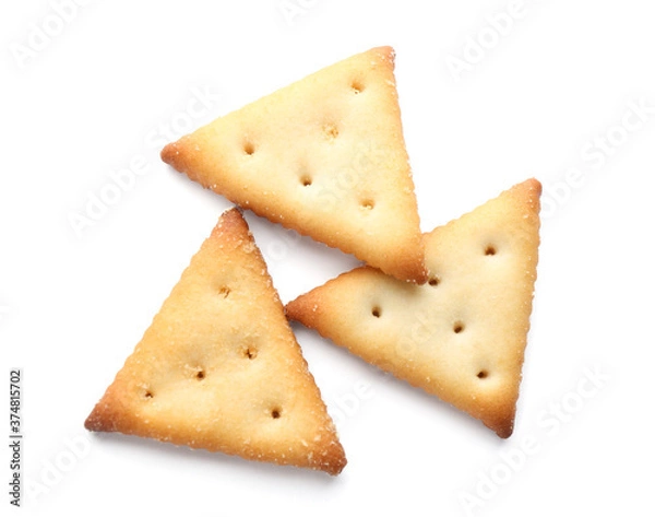 Fototapeta Delicious crispy crackers isolated on white, top view