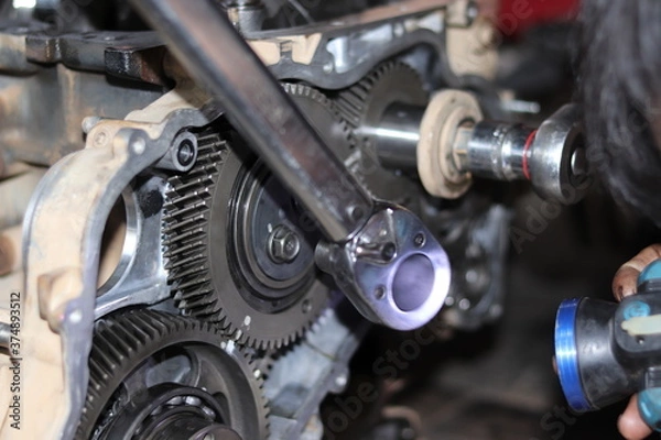 Obraz The mechanic is checking the engine.