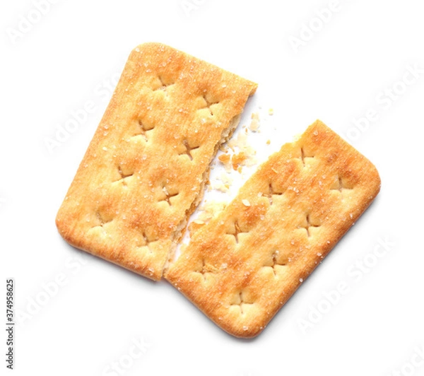 Fototapeta Broken delicious crispy cracker isolated on white, top view