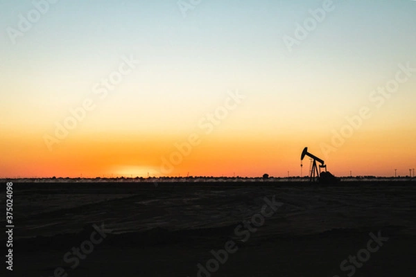 Obraz oil pump silhouette at sunset