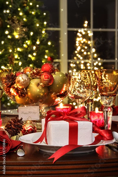 Fototapeta Festive table setting with red ribbon gift