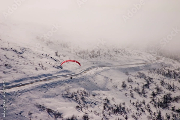 Fototapeta paragliding in the mountains