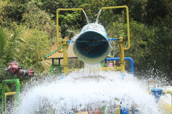 Fototapeta Water pouring out of a huge bucket