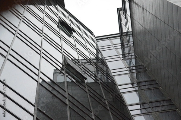 Obraz Windows of high business building reflecting the sky.