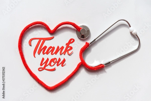 Fototapeta Stethoscope forming heart with its cord. Thank you doctor and Nurses and medical personnel team. Healthcare concept. Space for text. Soft focus. Top view.