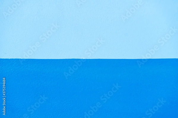 Fototapeta Abstract blue color of wall texture background with copy space for design and decoration. Two-tone background fashionable glamorous divided into two parts.