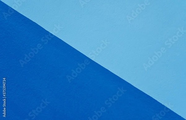 Fototapeta Abstract blue color of wall texture background with copy space for design and decoration. Two-tone background fashionable glamorous divided into two parts.