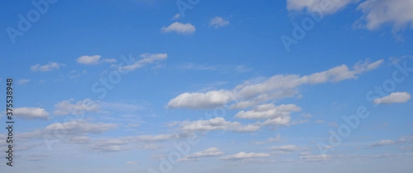 Obraz Blue spring sky with white clouds. Beautiful background.