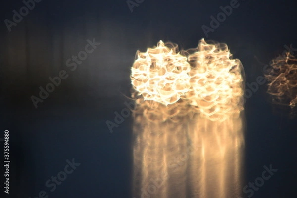 Fototapeta burning candle in the dark