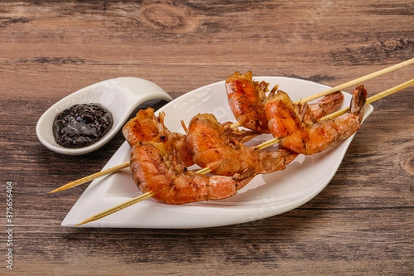 Obraz Grilled prawn skewer with pepper sauce
