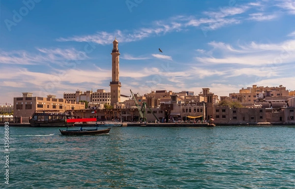 Fototapeta A view of the restored old Dubai next to the Dubai Creek in the UAE in springtime