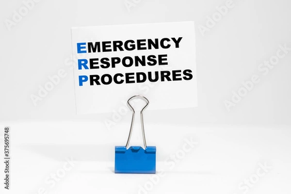 Obraz EMERGENCY RESPONSE PROCEDURES nscription on a white business card on a white endless background in a blue clip.