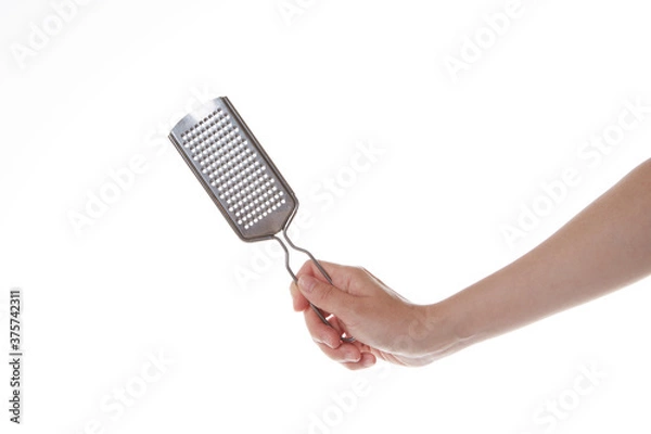 Fototapeta hand holding cheese grinder vertically.