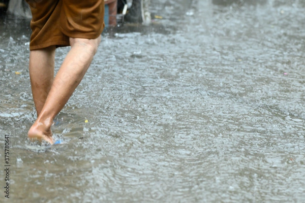 Obraz Legs walking through the flood