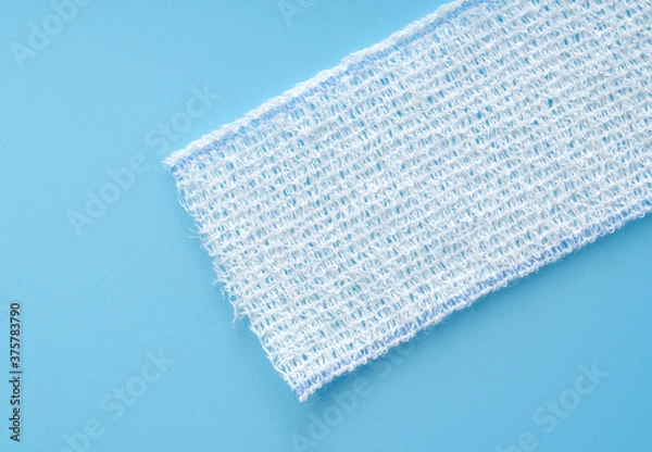 Obraz Bandages on a blue background.