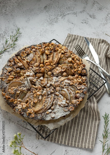 Obraz Сhocolate cake with pears and nuts