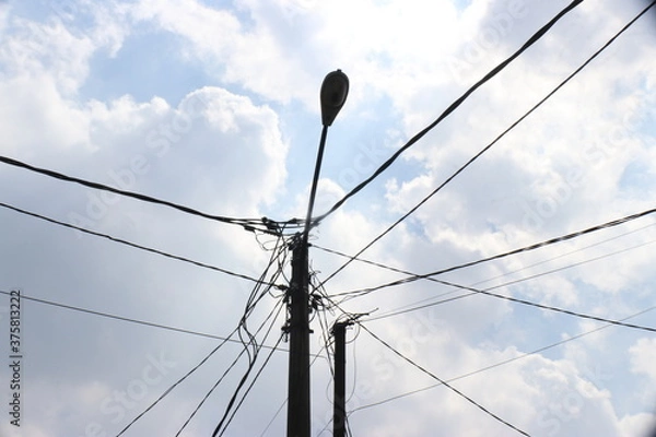 Fototapeta a jolt of power lines in developing countries