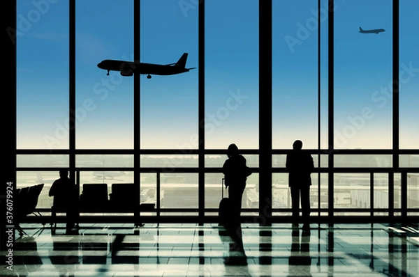 Obraz Silhouette in the Airport Terminal Lounge Viewing Planes