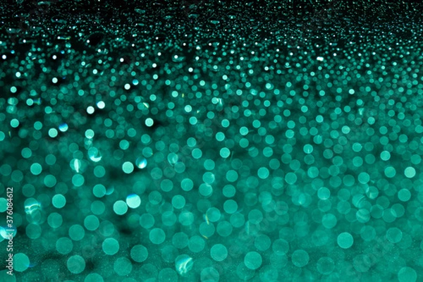 Fototapeta Abstract green bokeh texture on green background