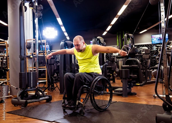 Obraz Disabled man training in the gym of rehabilitation center