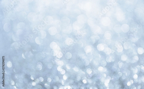 Fototapeta White glitter vintage lights background. Bokeh silver and white. de-focused copy space.