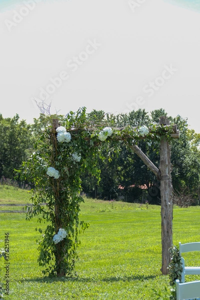 Fototapeta rustic archway decorated for a wedding