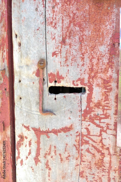 Fototapeta rusty latch on an old red door