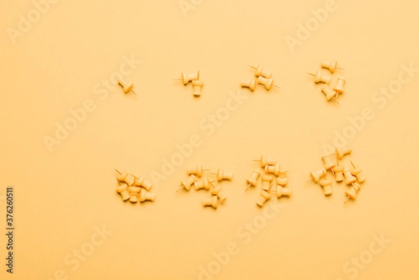 Fototapeta Set of 8 yellow push pins in grupes to cutoff