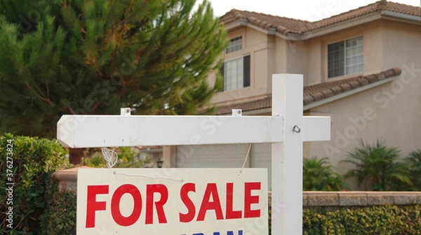 Fototapeta "For Sale" sign in front of a generic California home 