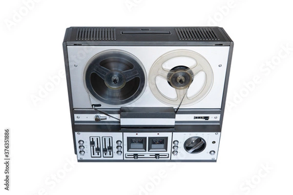 Fototapeta Stereo tape deck recorder player with reels on background.