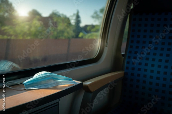 Fototapeta Empty inside train bus subway public transport with window view and blue seats people tourist new normal social distancing safe travel with hygiene face mask protect from covid corona virus